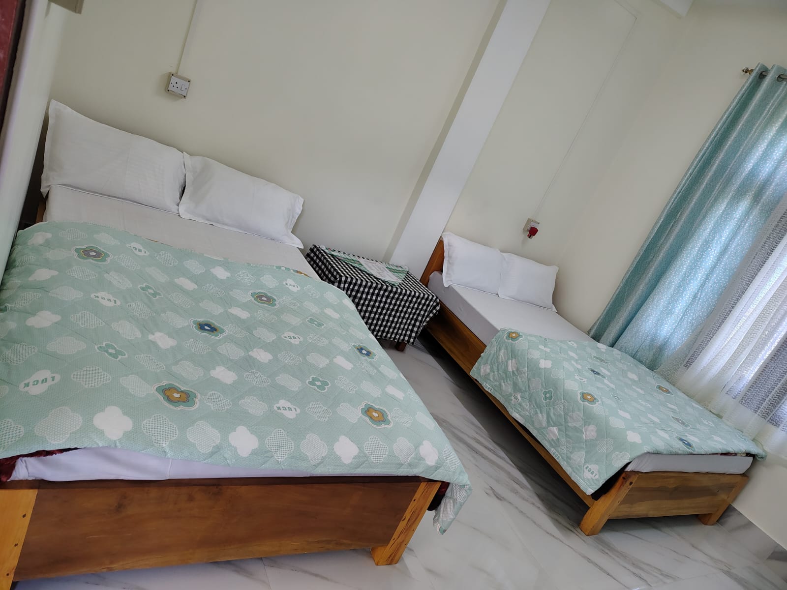 Twin-bed room with fresh linen at Kyit-Pu Comfort Stay