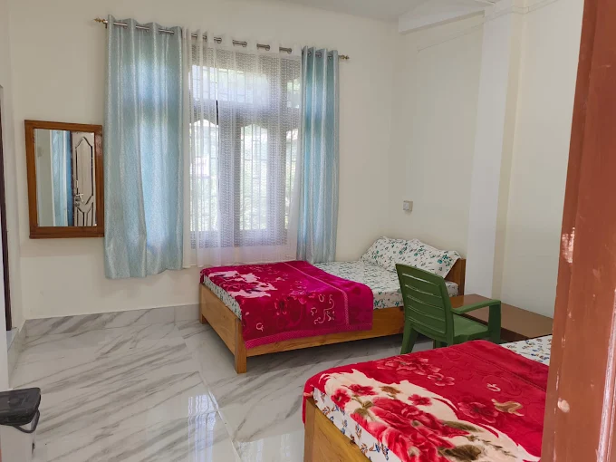 Bright family room with twin beds at Kyit-Pu Comfort Stay