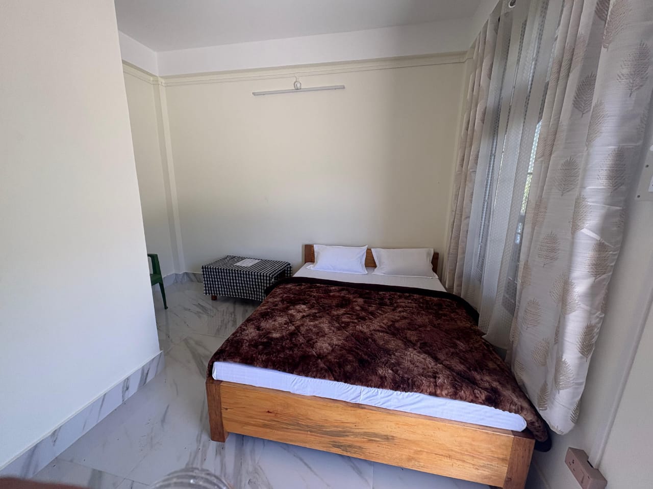 Single bedroom with warm bedding at Kyit-Pu Comfort Stay