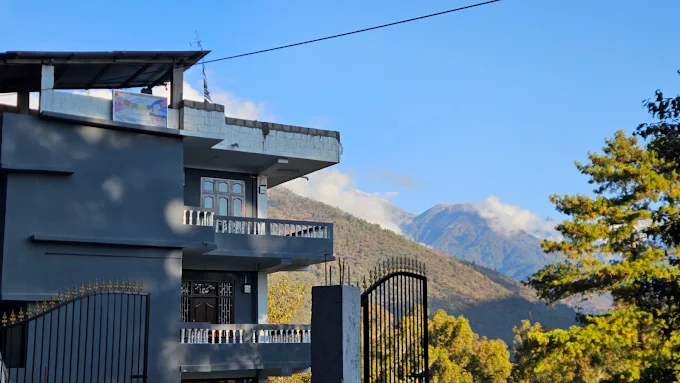Kyit-Pu Comfort Stay exterior with Himalayan mountain backdrop
